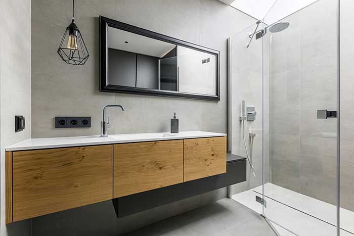 Bathroom with integral countertop sink and glass doors