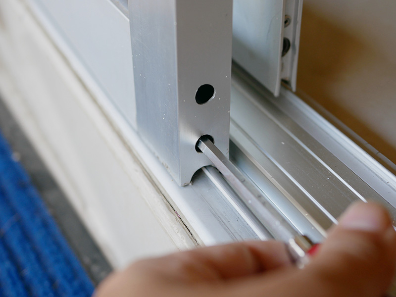 man-fixing-window